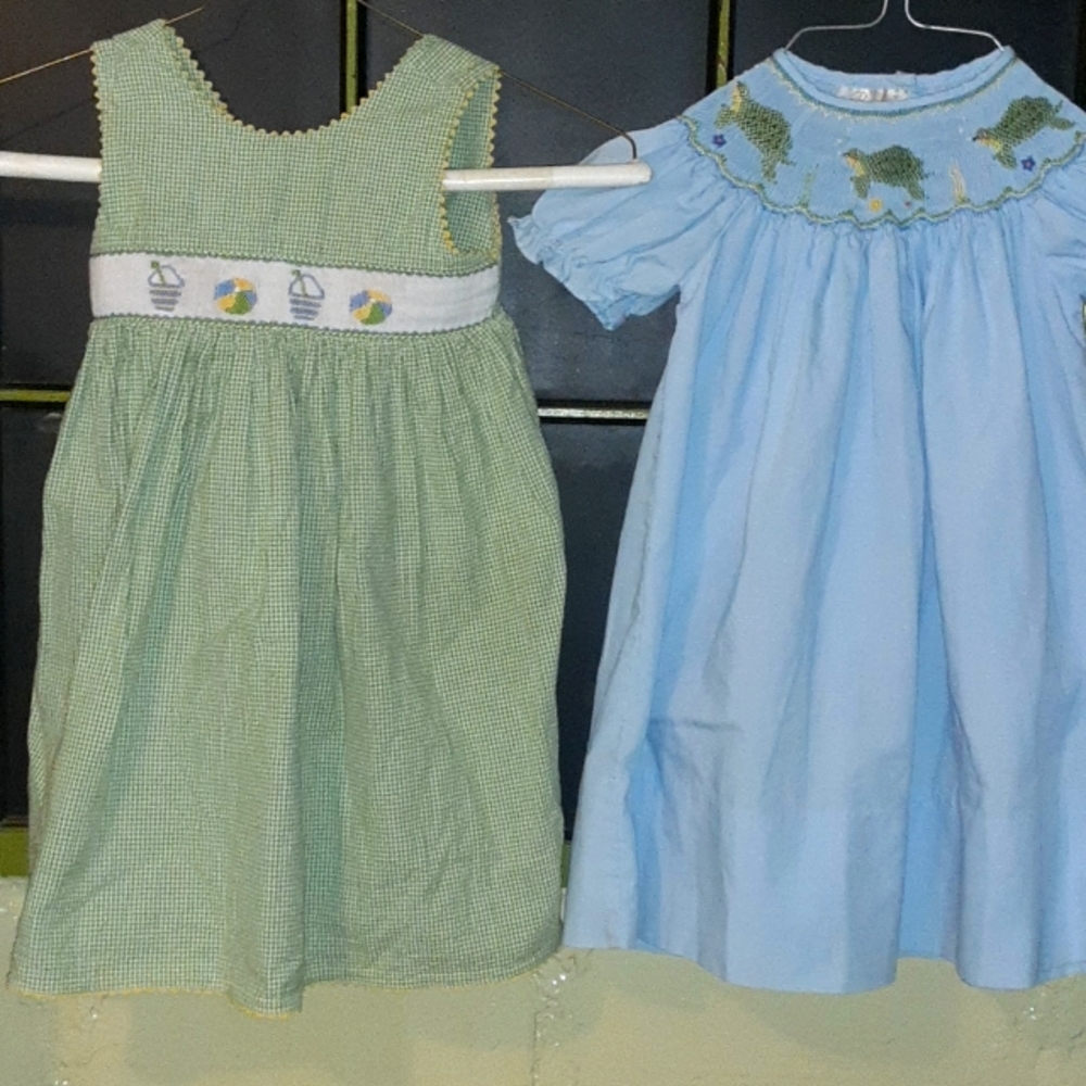 2 baby dresses 12,18 mo